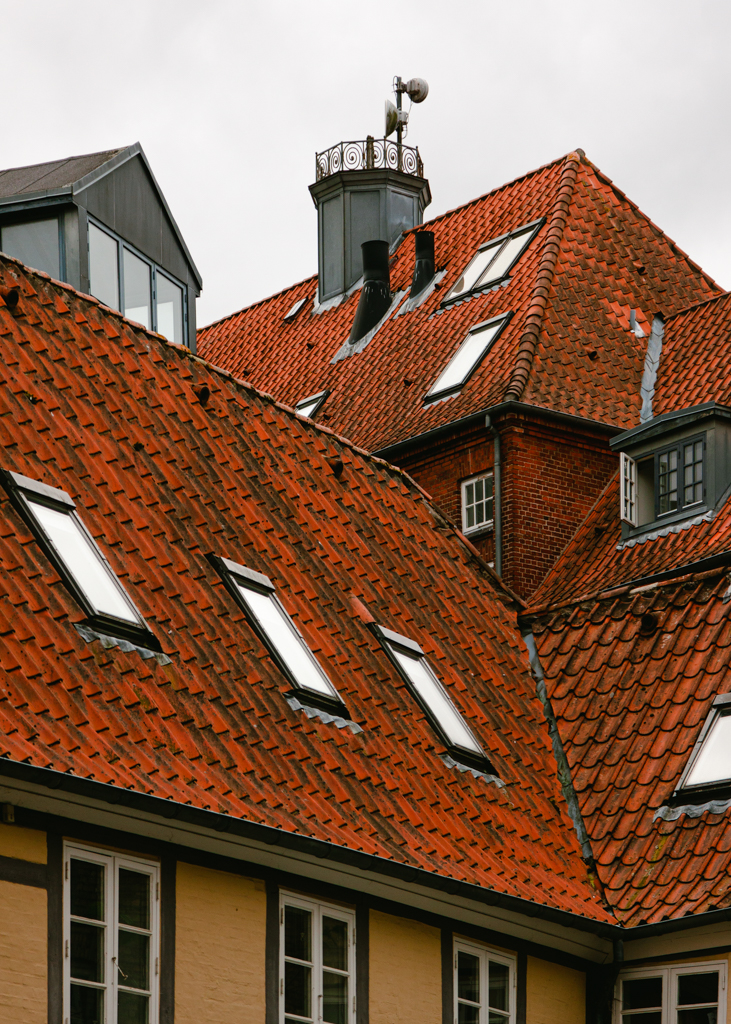 A closeup shot of the copper shingle roof on a house.