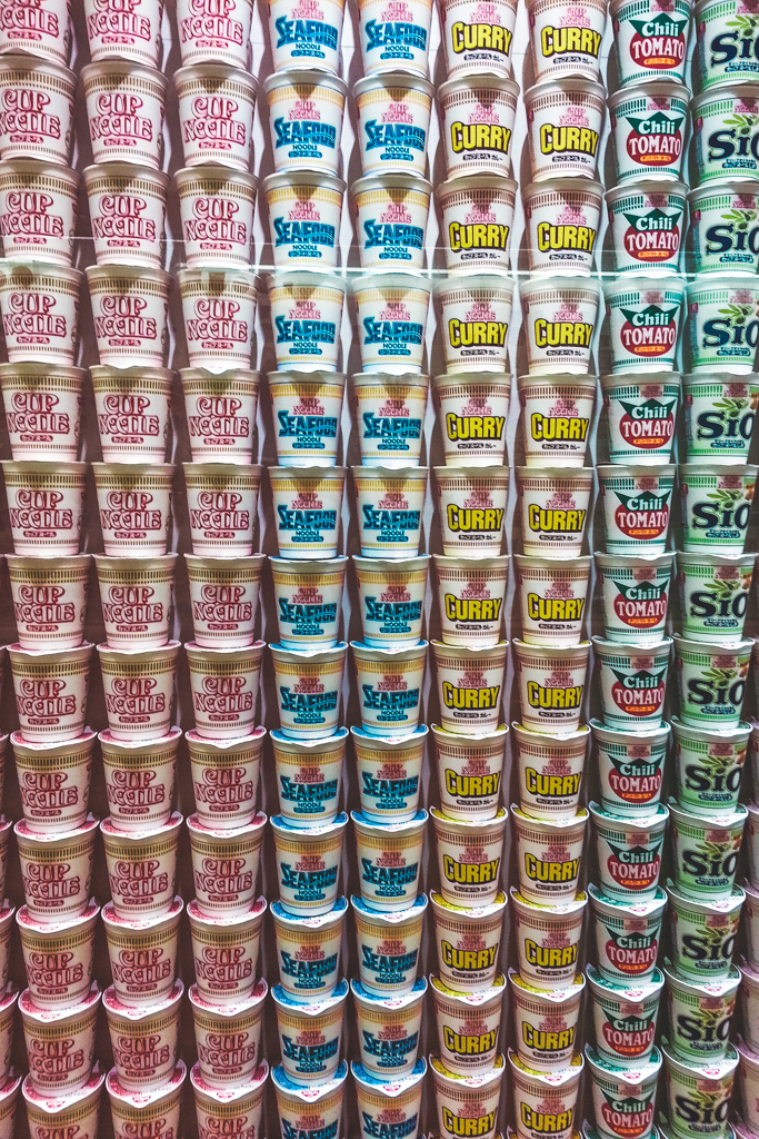 A wall filled with a variety of Cup Noodles from floor to ceiling in the Cup Noodle Museum.